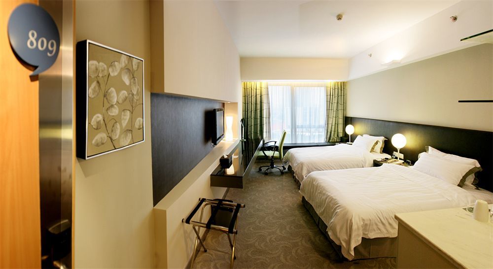 Yi-Wu Commatel Hotel Cantão Exterior foto